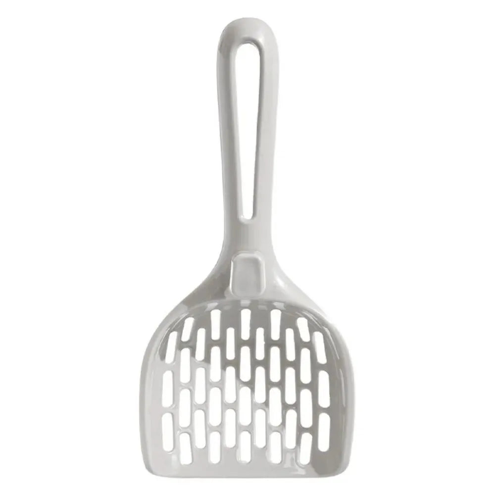 Grey plastic cat litter scoop standing upright in its attached storage base