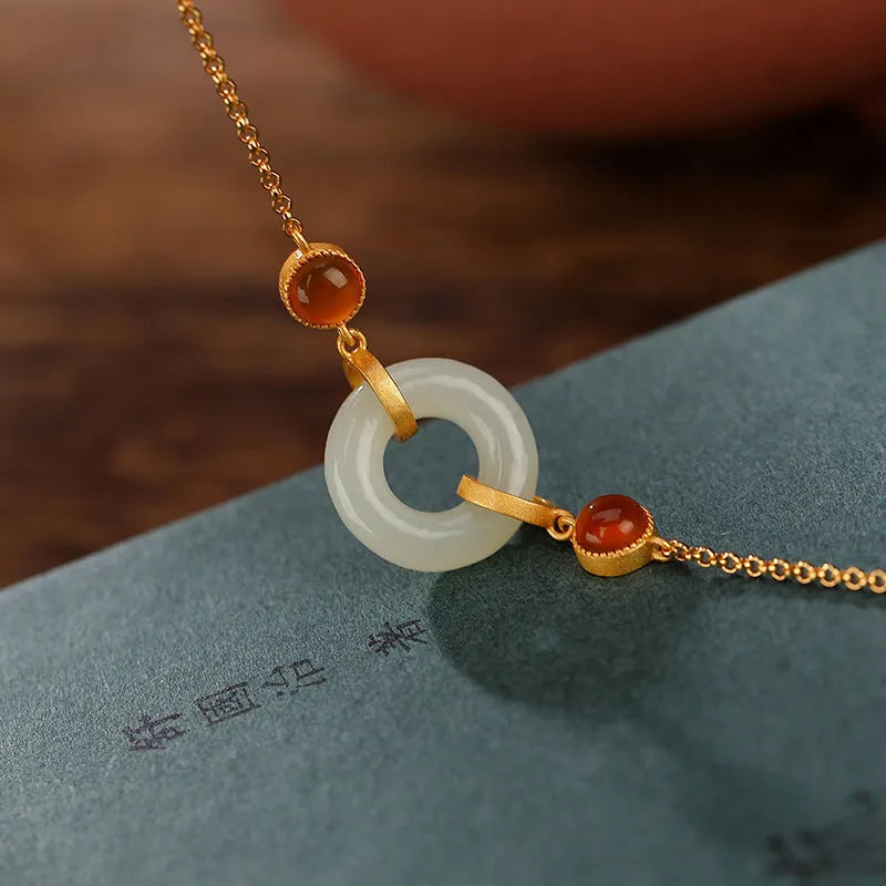 Gold-plated sterling silver bracelet with natural Hetian jade stone and peace buckle closure