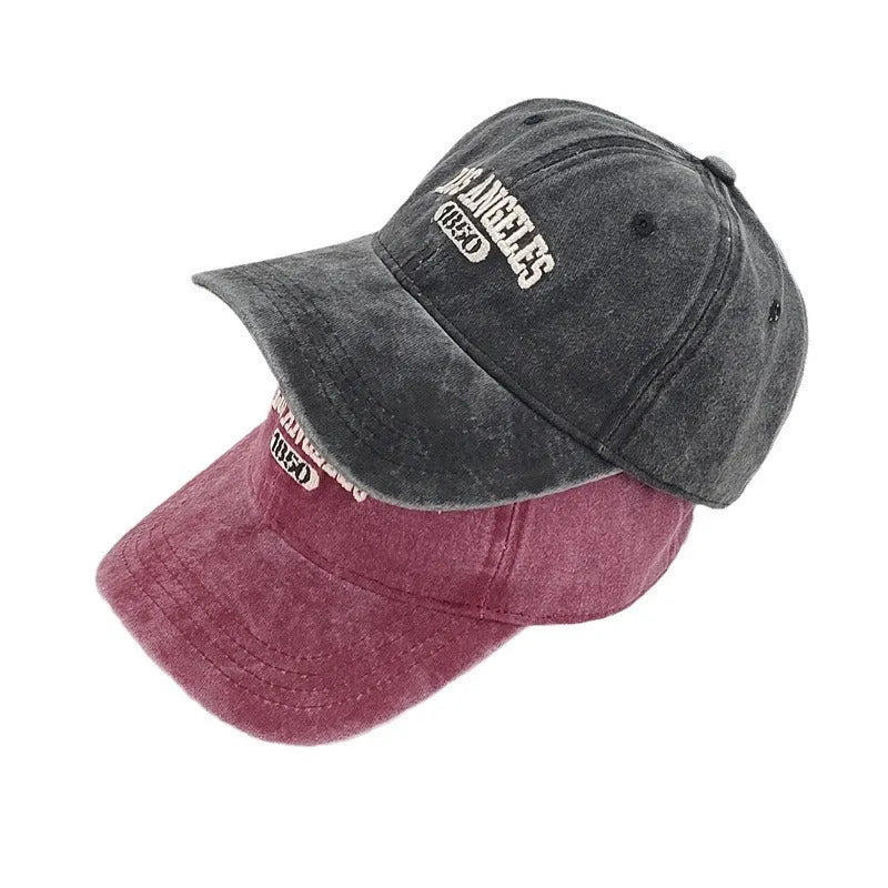 Retro personalised peaked cap with embroidered letters on washed distressed fabric