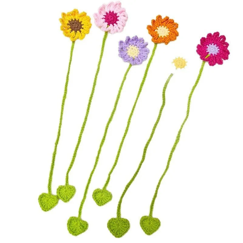 Hand-crocheted wool bookmark with small daisy motifs in multiple colour options