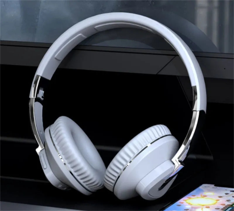 Wireless Bluetooth over-ear headphones in black colour with all-inclusive ear design showing AUX port and control buttons