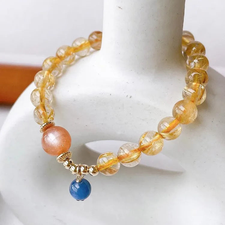 Gold rutilated quartz sunstone crystal bracelet with round diamond-shaped beads