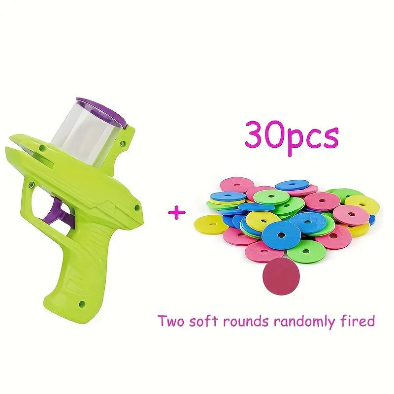 Green interactive cat toy launcher with foam disc on flat indoor surface.