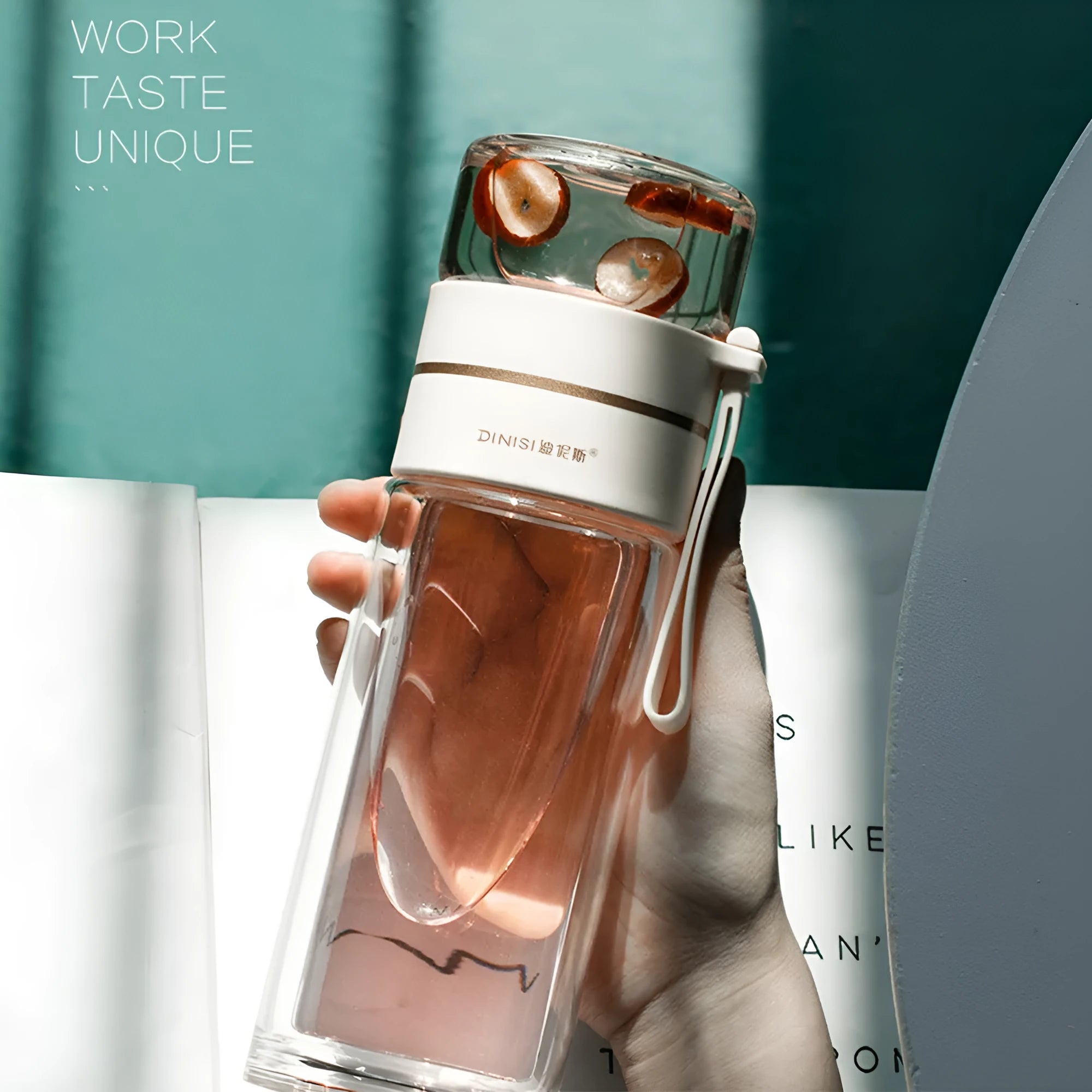 Double wall glass tea infusion bottle with stainless steel filter and rope handle in various colours.
