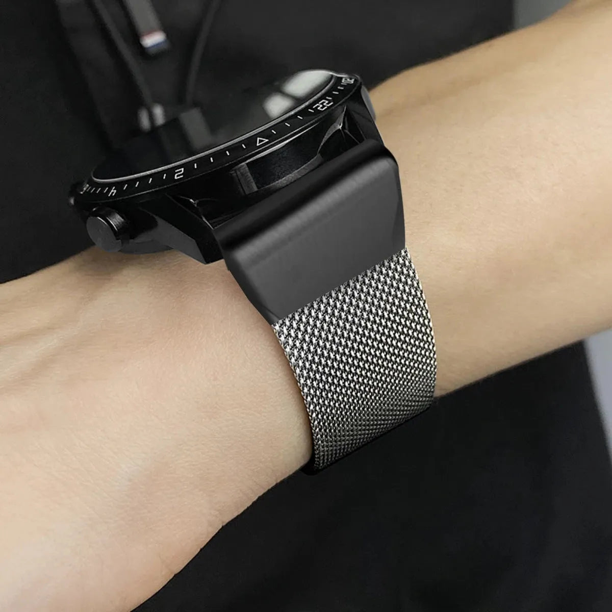 Silver stainless steel watch strap for Garmin Fenix series smartwatch showing lug detail.