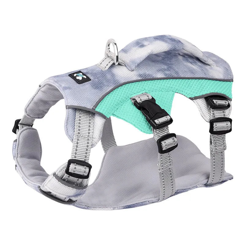 Light blue reflective pet harness chest strap with adjustable clips on a grey background