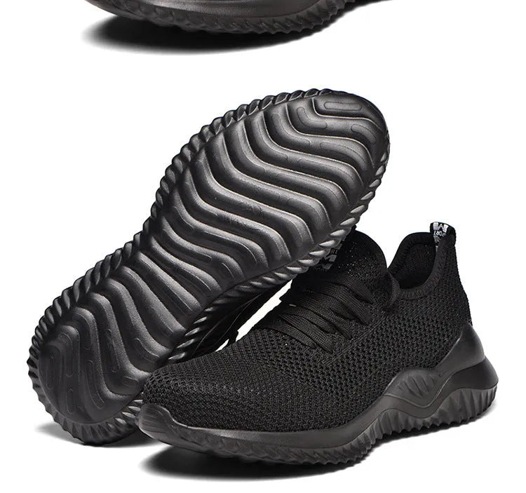 Men's black safety work shoes with steel toe cap on a grey background
