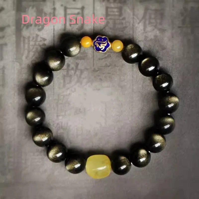 Handmade golden obsidian bracelet with 10mm geometric beads on a wrist, showing ethnic zodiac design.