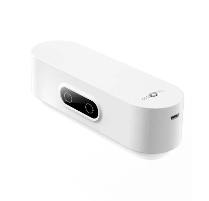 White USB rechargeable magnetic LED night light with touch controls on a metal study cabinet.