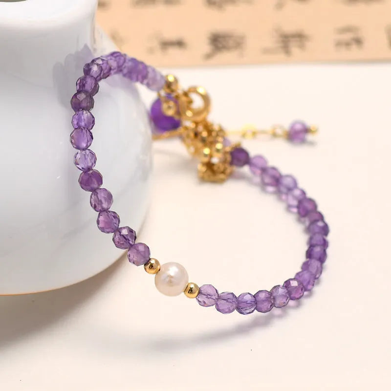 Women's Chinese style crystal bracelet with diamond-shaped pearls and electroplated finish in amethyst colour
