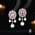 Oval geometric copper earrings with inlaid zircon accents and pearl tassel drops in light purple colour