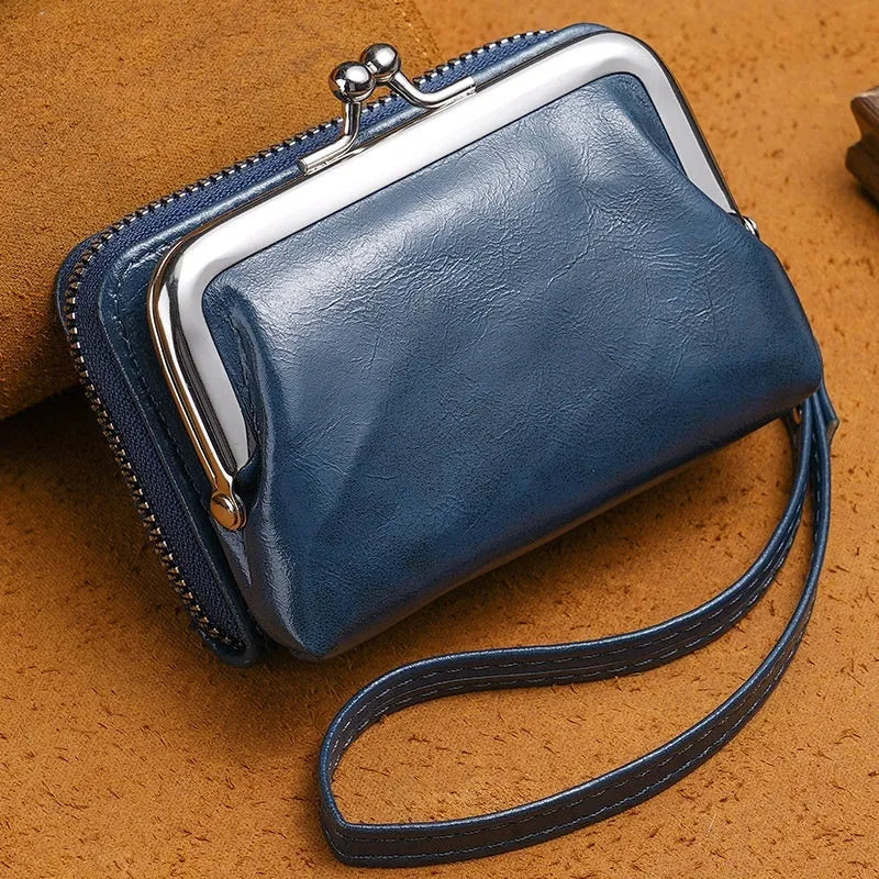 Ladies coin purse with a metal buckle and a long silver clip, shown in a selection of colours.
