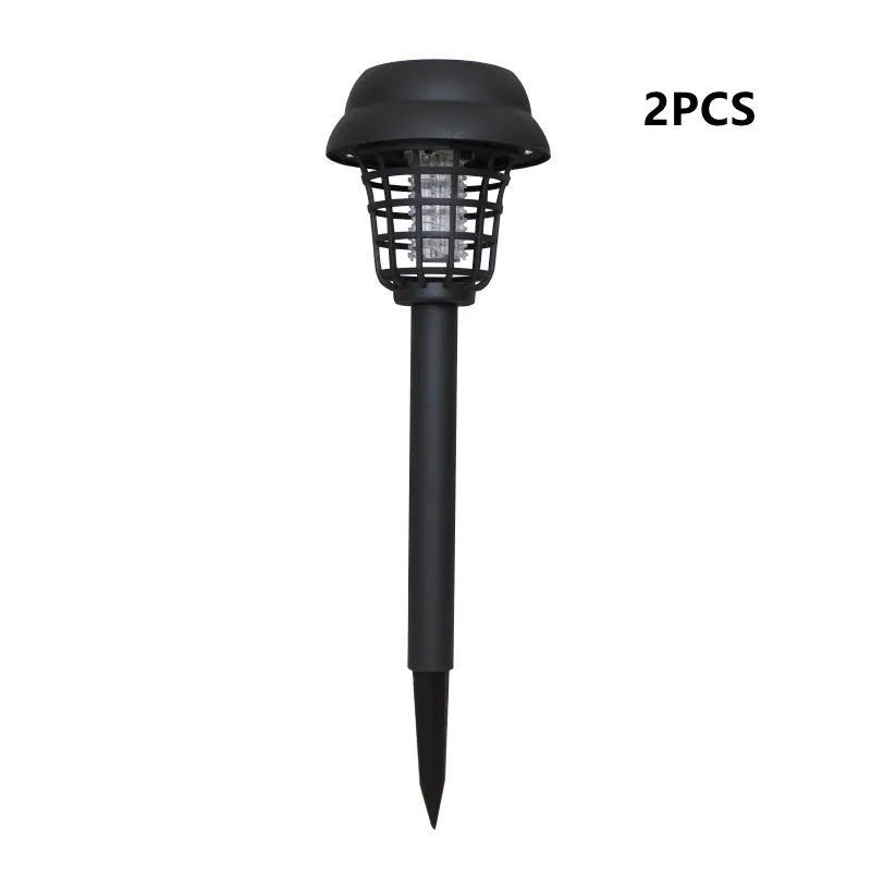 Small white and purple solar-powered mosquito killer lamp for outdoor garden use.