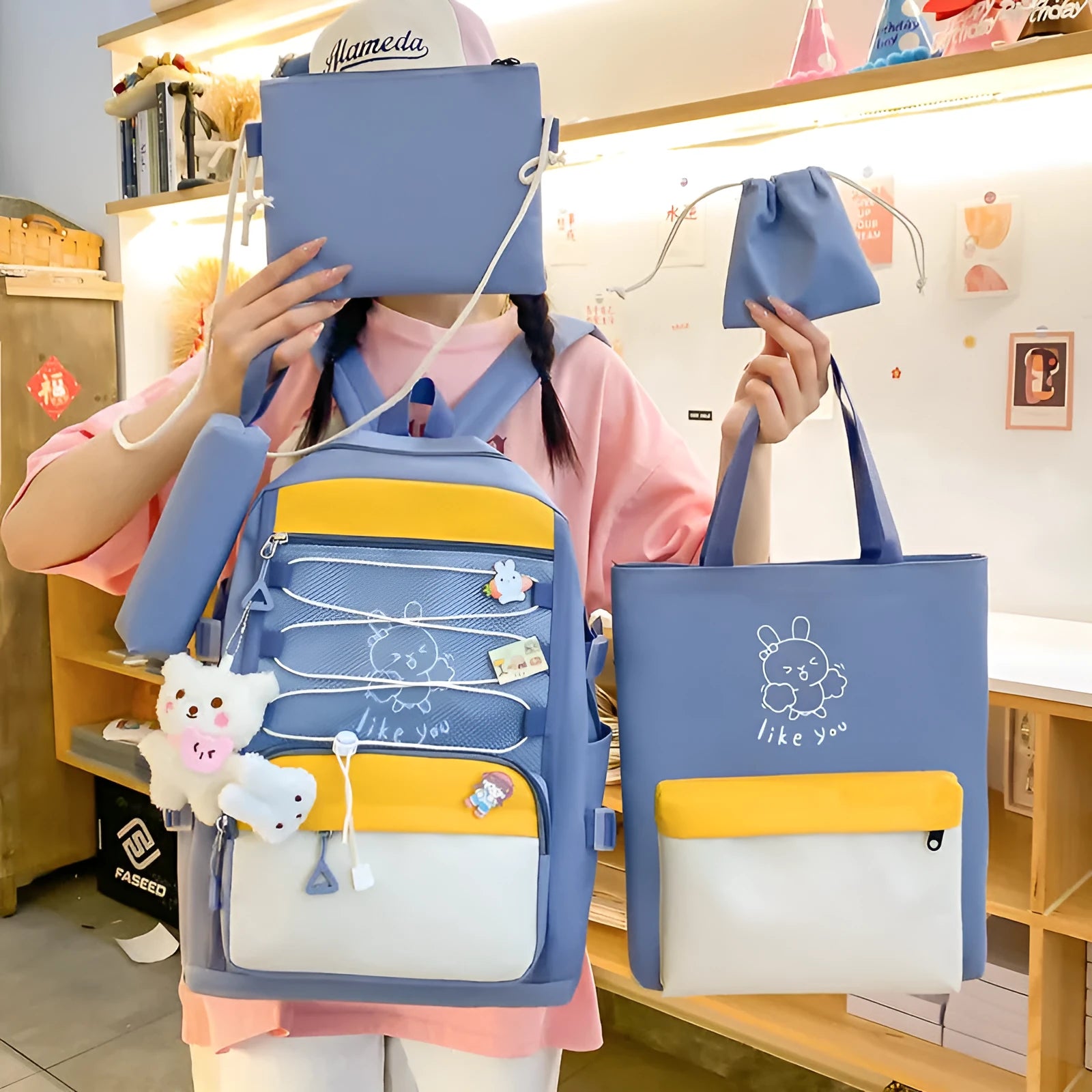 Solid colour nylon school backpack with curved shoulder straps, shown in black, blue, pink, and purple options.