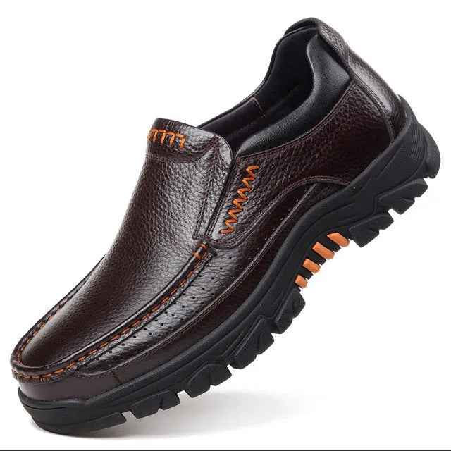 Black and brown business casual slip-on leather shoes with a rubber sole.
