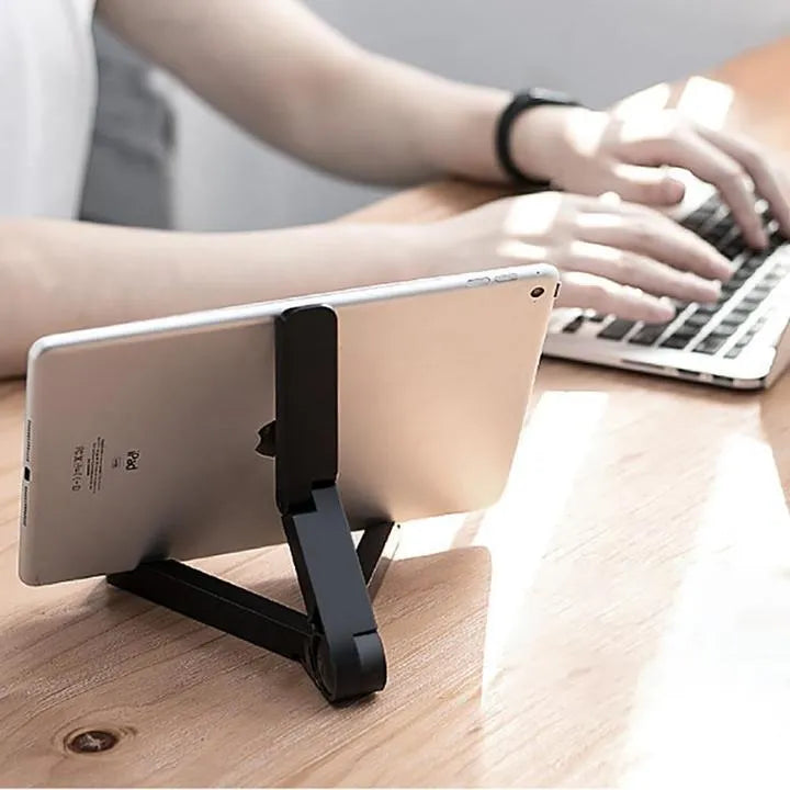 Black foldable tablet holder showing folded size and non-slip rubber surface for device protection