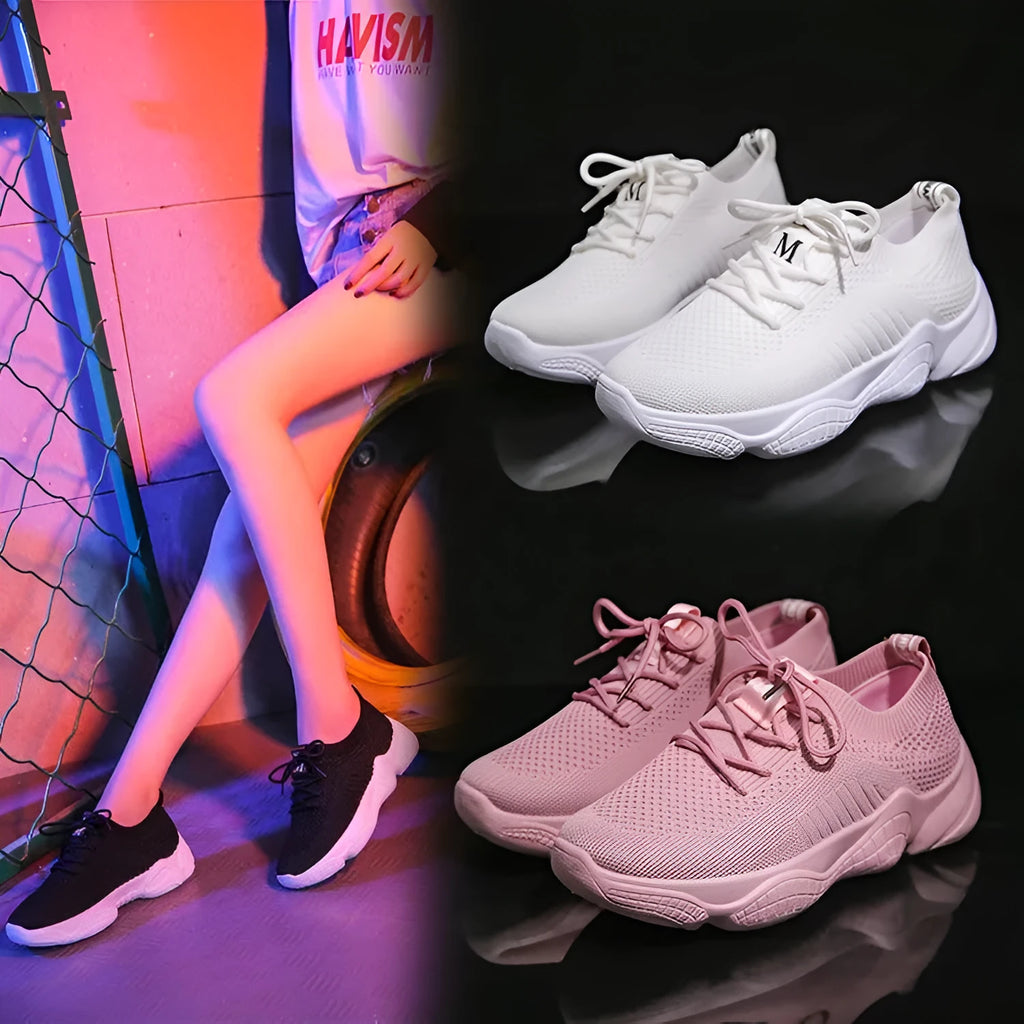 Women's white thick-soled woven sports shoes with front strap on a light background.