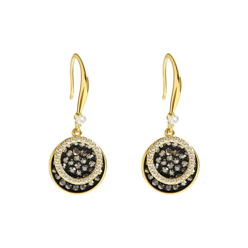 Black geometric alloy earrings with round piece shape measuring 3.6cm in length.