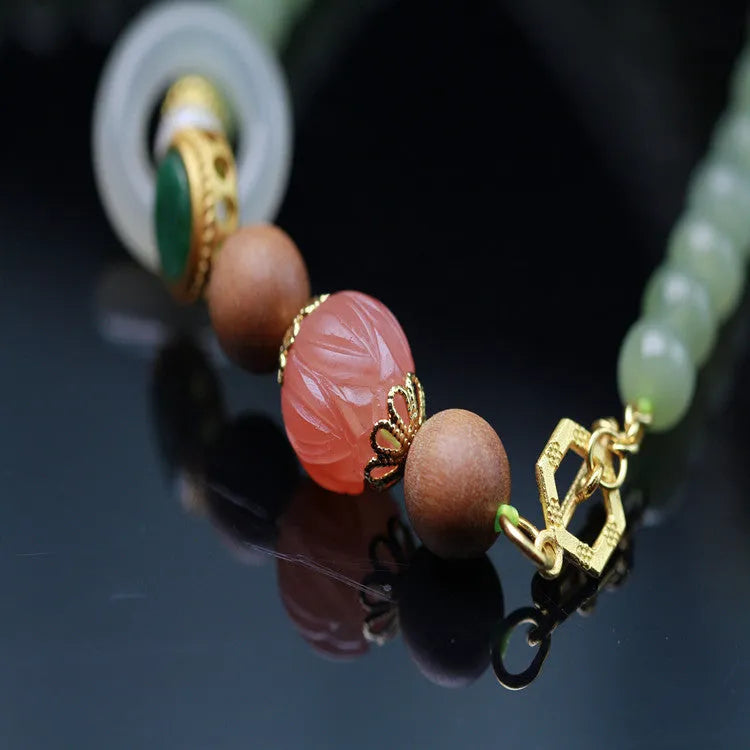 Hetian jade lotus bead necklace and bracelet set with white sandalwood and beeswax accents.