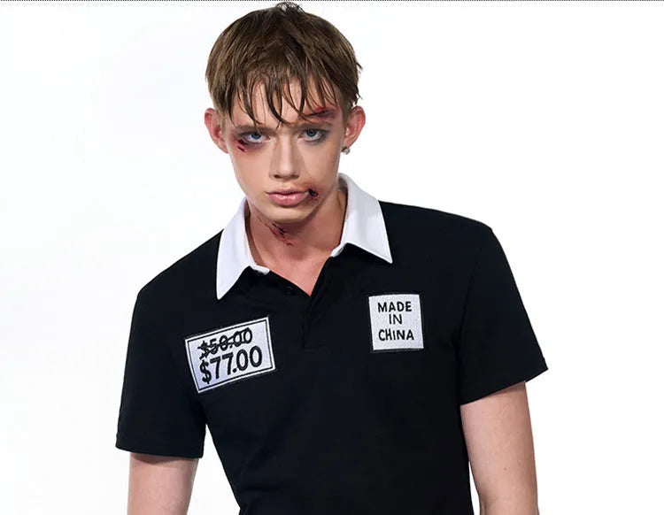 Black slim fit men's short sleeve polo shirt with embroidery hat detail on the chest.