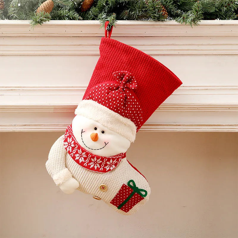 Large red and white knitted Christmas stocking with Santa Claus design for fireplace decoration
