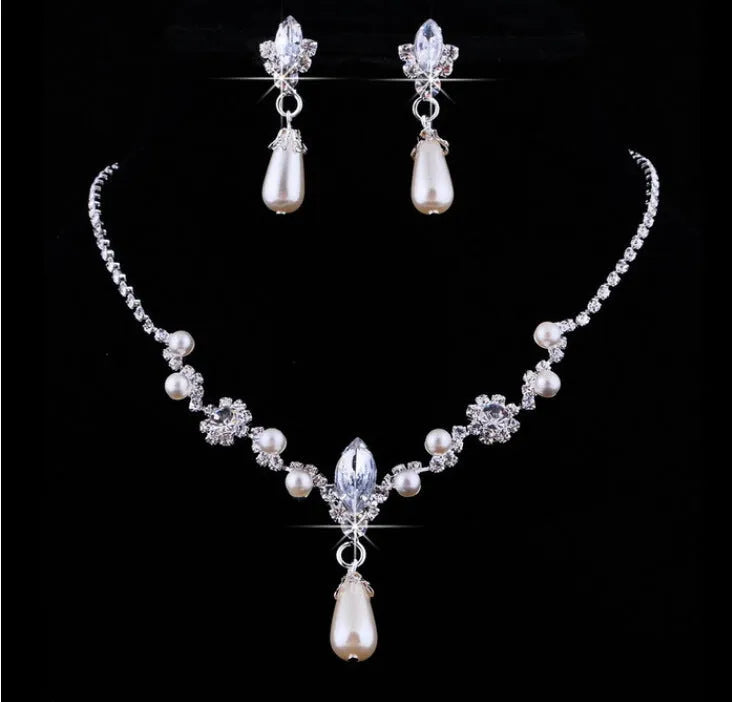 Drop pearl necklace and earrings set in white, blue, and pink for bridal and formal occasions