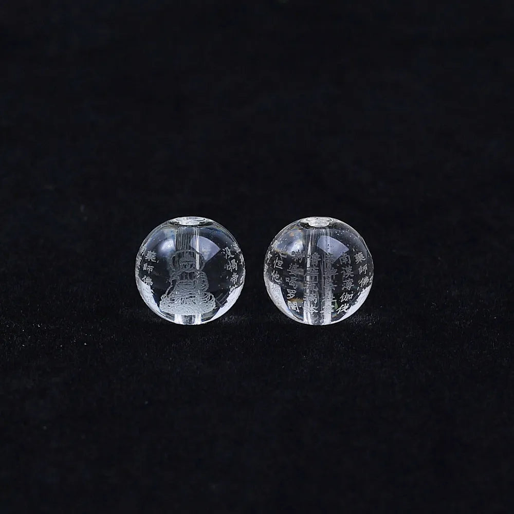 10mm glass Heart Sutra beads with polished surface showing clear script details