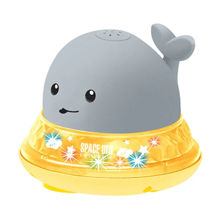 Grey whale bath toy spraying water with LED lights in baby bath