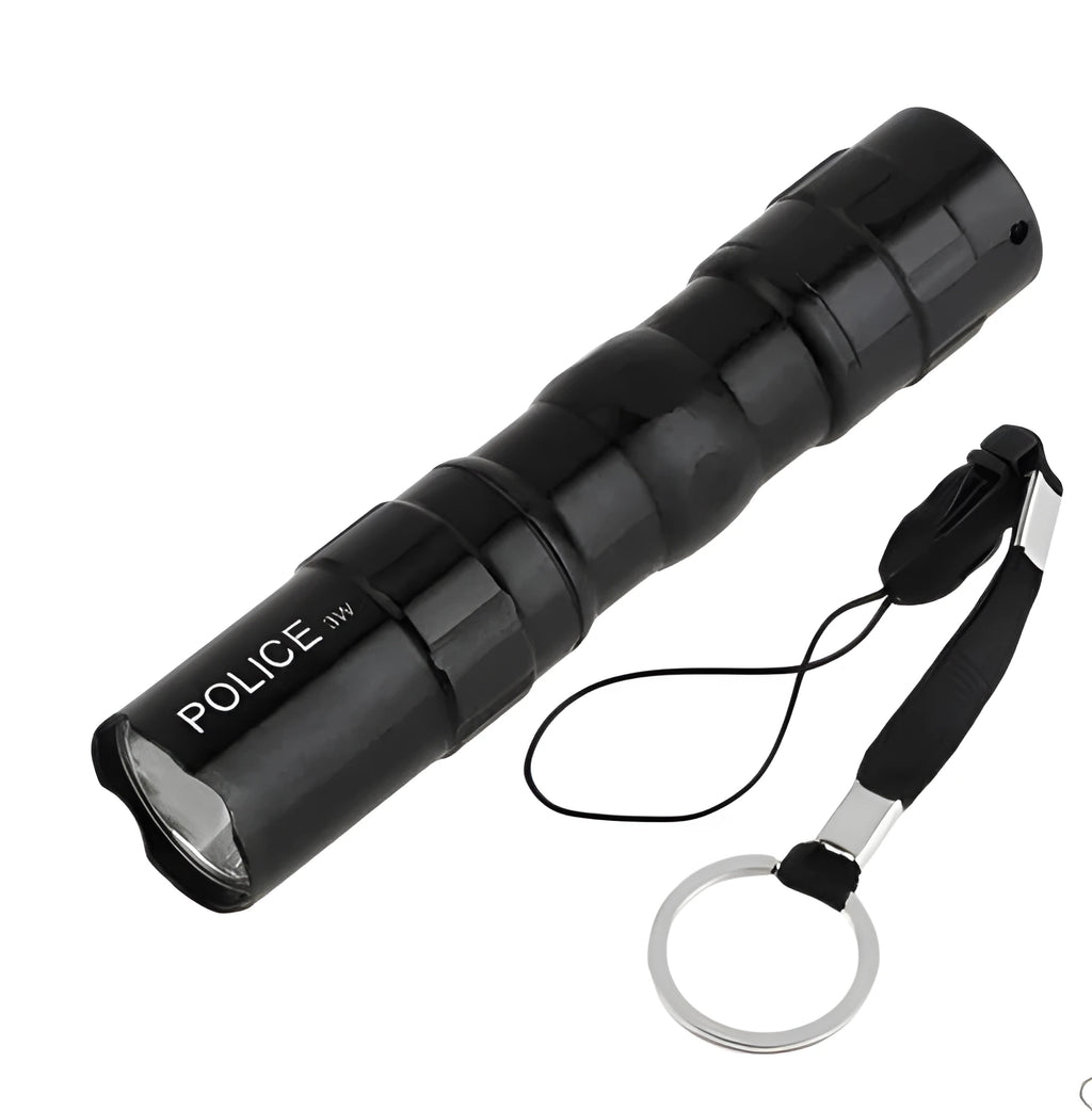 Black aluminium LED mini flashlight showing compact size with measurement scale