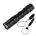 Black aluminium LED mini flashlight showing compact size with measurement scale