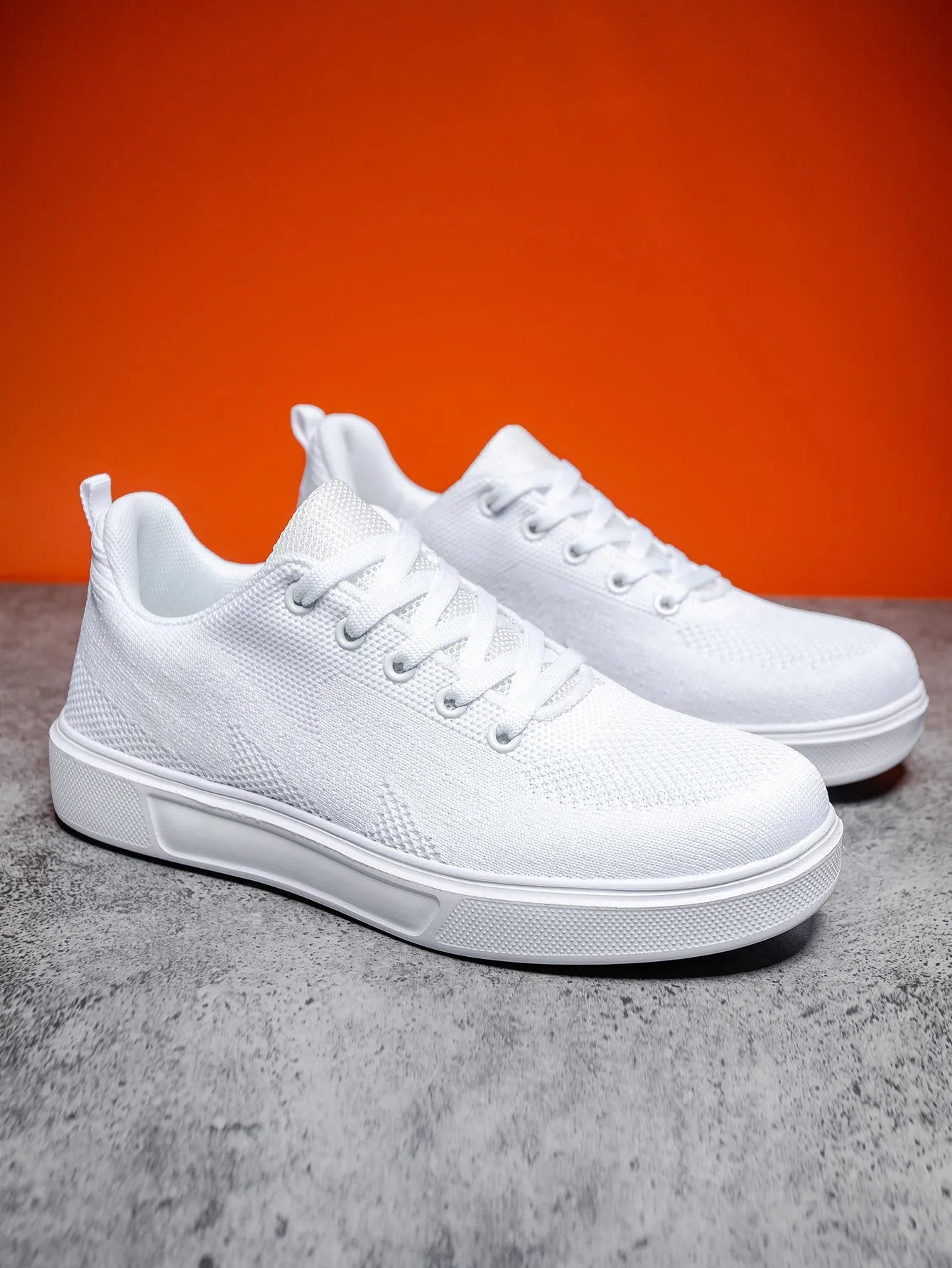 Light white and black mesh casual sneakers with flat EVA soles and round toes on a white background.