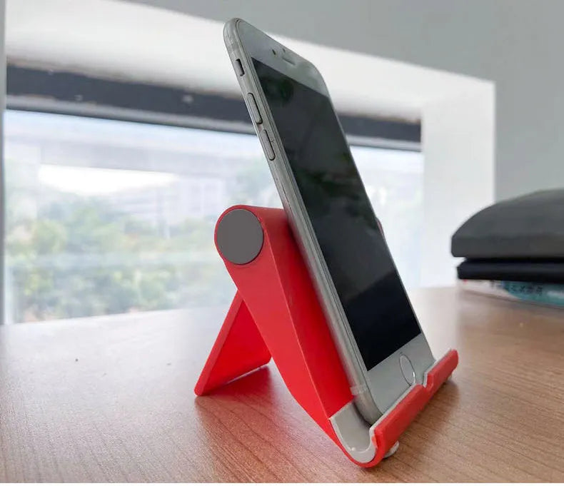 PE folding adjustable desktop phone and tablet stand in assorted colours.