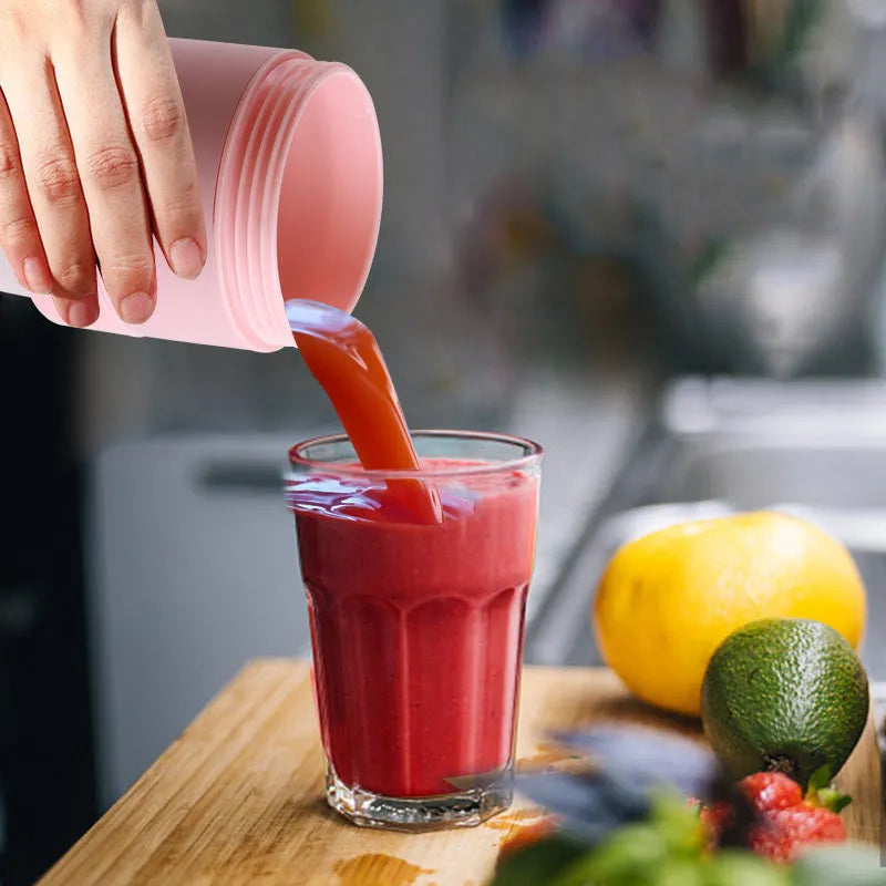 Blue mini portable blender with USB charging port and stainless steel blades, shown extended and collapsed.
