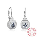 s925 sterling silver crown rhinestone earrings on a white background, polished silver finish with clear stones