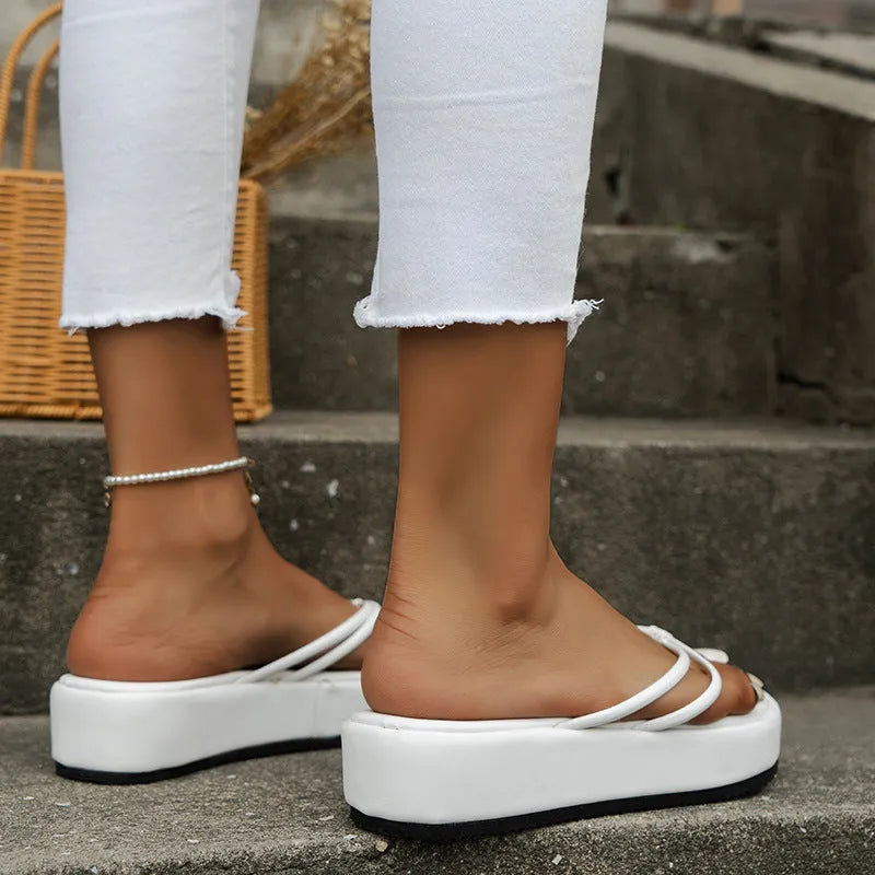 Pair of thick-soled casual flip-flops with a herringbone pattern PU upper and rubber sole, shown in multiple colour options.