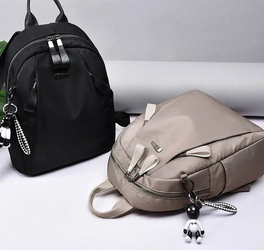 Medium Oxford cloth backpack in grey colour showing interior organisation pockets
