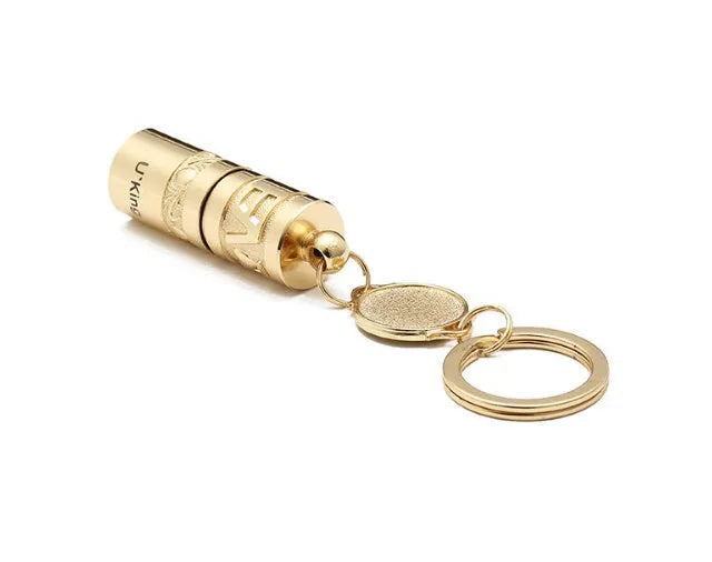 Gold zinc alloy waterproof LED keychain torch for outdoor and emergency use.