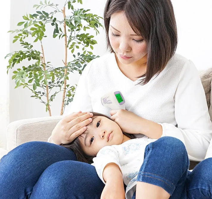 Non-contact infrared thermometer HTD883A with forehead measurement button and digital display for 0.5-second temperature reading
