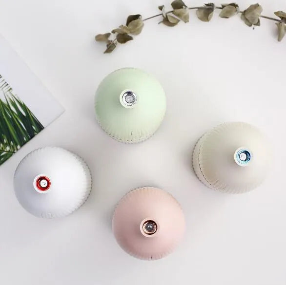 White ultrasonic aromatherapy diffuser with LED light, 300ml water tank, and USB cable.