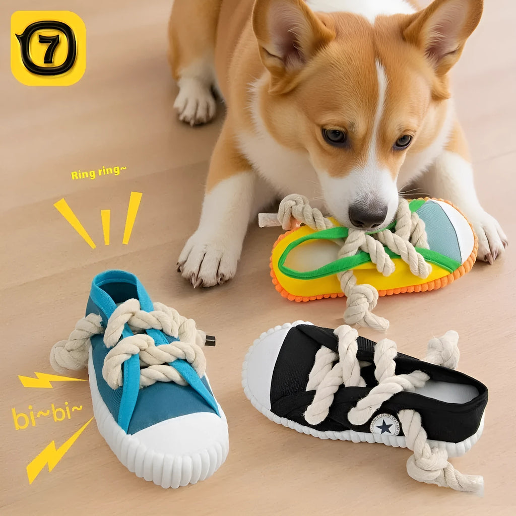 Yellow plastic dog slipper chew toy with a self-hi sound feature for biting.