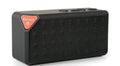 Cannon X3 small cube-shaped wireless Bluetooth portable speaker in five colour options on a table.