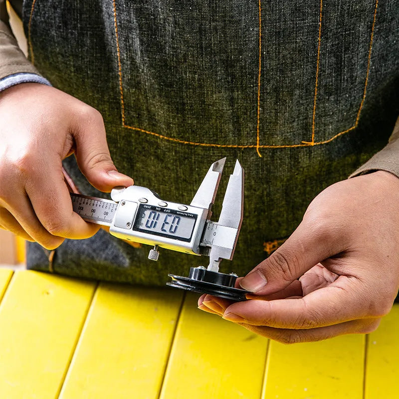 Stainless steel digital vernier caliper showing measurement on LCD display.