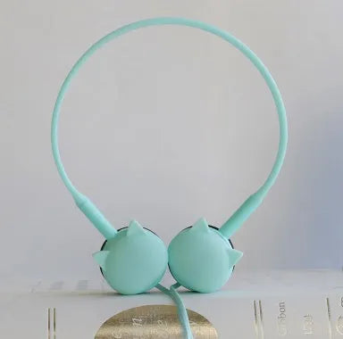 Wireless cat ear stereo earphones in pink, blue, black, and white colours with a charging case
