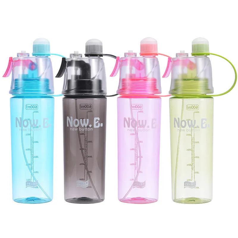 Portable outdoor sports mist spray cup with handle, transparent body showing scale markings, and spray mouth