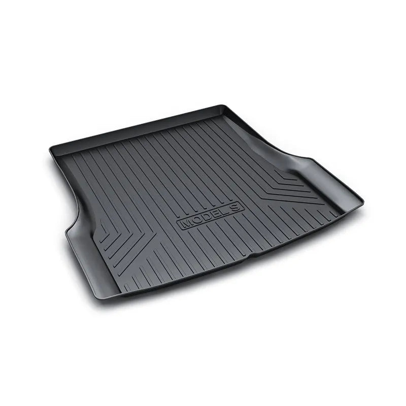 Custom rubber floor mats for Tesla cars, showing TPE footrest section and model-specific contours.
