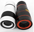 12X magnification phone telescope with mounting clip next to a smartphone