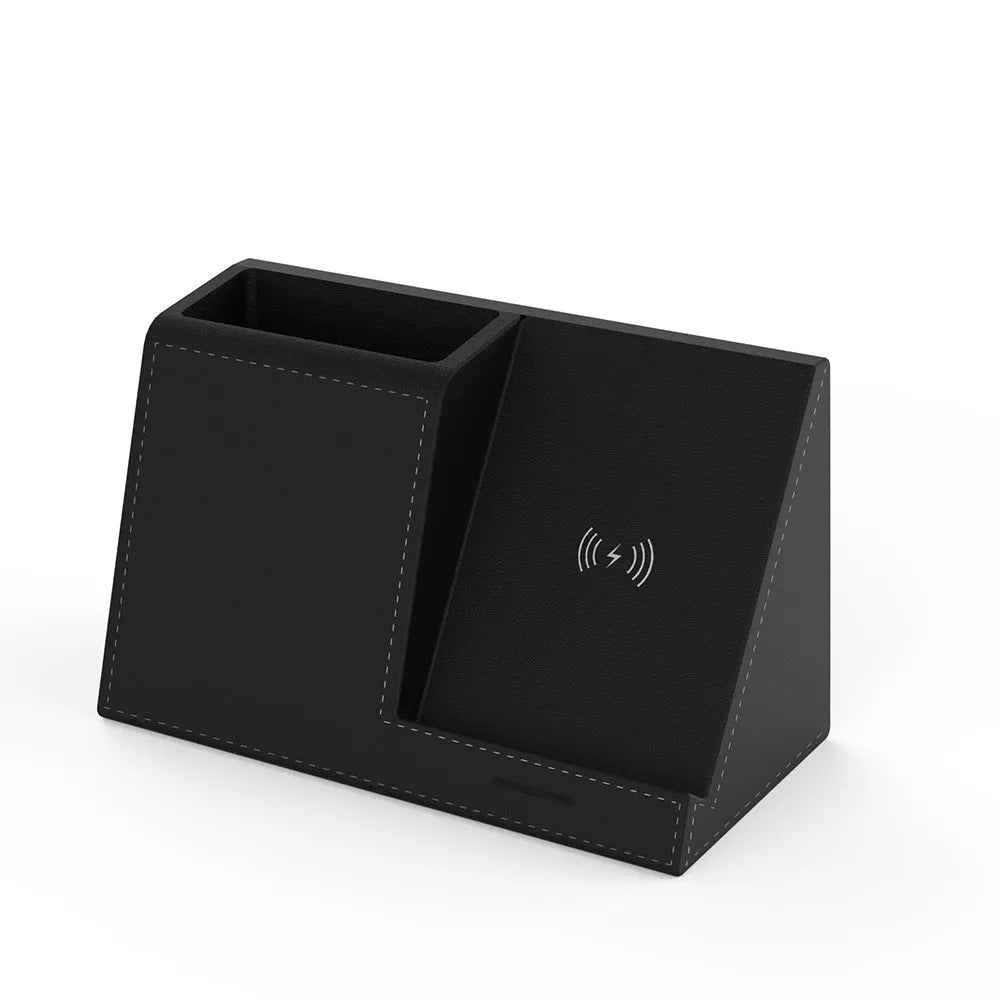 Black leather pen holder with integrated wireless phone charging pad on a desk