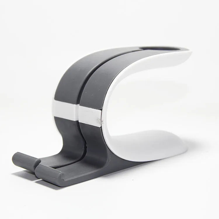 Grey desktop charging stand holding an Apple iPhone and an Apple Watch on charge.
