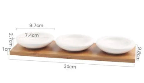 Porcelain dried fruit dish set with wooden board showing compartmentalised snack plates