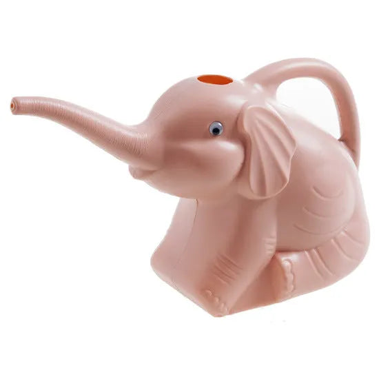 Pink baby elephant-shaped watering can with a long nozzle and bottle-style handle on a table.